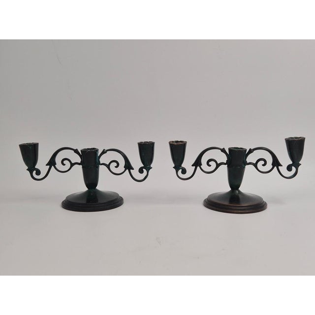 A rare, decorative pair of solid bronze candelabras with patined surface, Danish Grace 1920/30s. Stamped: Bronze Denmark...