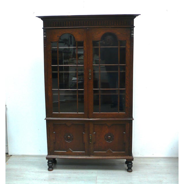 Antique bookcase, display cabinet, with two glass doors at the top and two doors at the bottom. Three adjustable shelves...