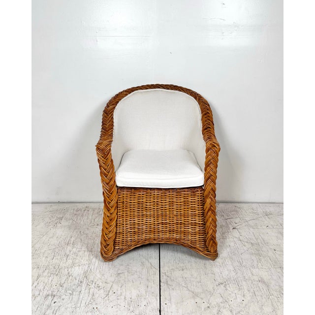 Vintage braided wicker chair. Wicker Works style thick woven wicker/rattan with braided trim. Upholstered seat. Would be...