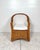 Vintage braided wicker chair. Wicker Works style thick woven wicker/rattan with braided trim. Upholstered seat. Would be...