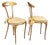 An elegant and versatile pair of vintage Italian side chairs by Palladio featuring sculptural gilt metal frames. MAKER'S...