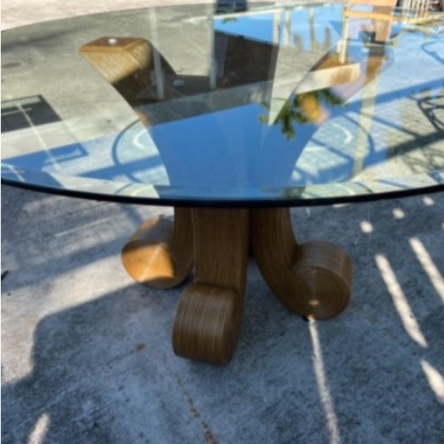 Beautiful vintage sculptural pencil reed rattan dining table styled after Gabriella Crespi. The curved pedestal base...