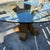 Beautiful vintage sculptural pencil reed rattan dining table styled after Gabriella Crespi. The curved pedestal base...