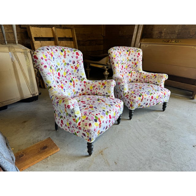 Elevate your space with this magnificent, matching pair of 19th-century French antique Napoleon III club chairs....