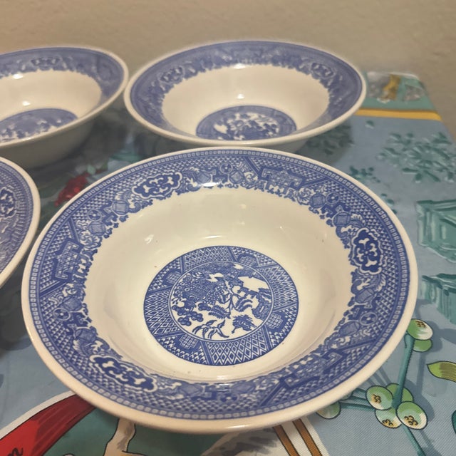 A classic set of four vintage porcelain shallow soup or pasta bowls featuring the iconic and timeless Blue Willow pattern....