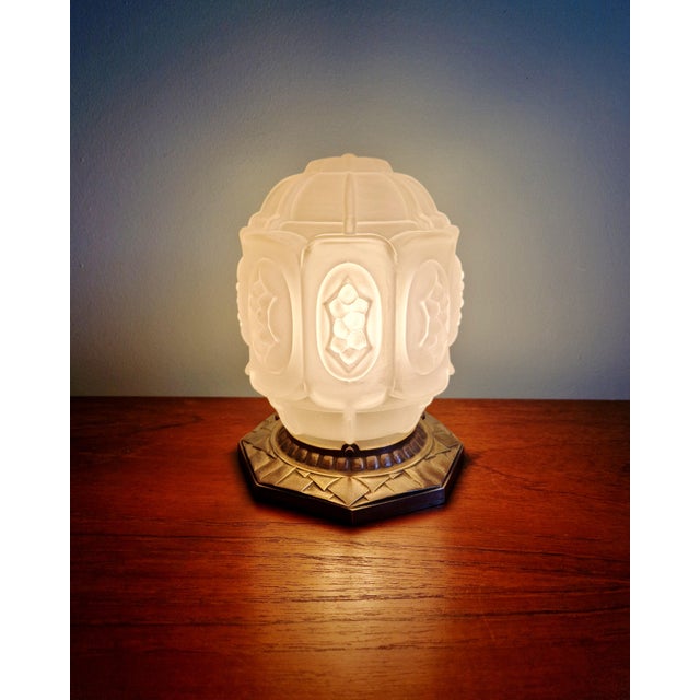 Art Deco nightlight in nickel-plated bronze with a frosted glass globe, 1920s-30s. The bronze is signed with the monogram...
