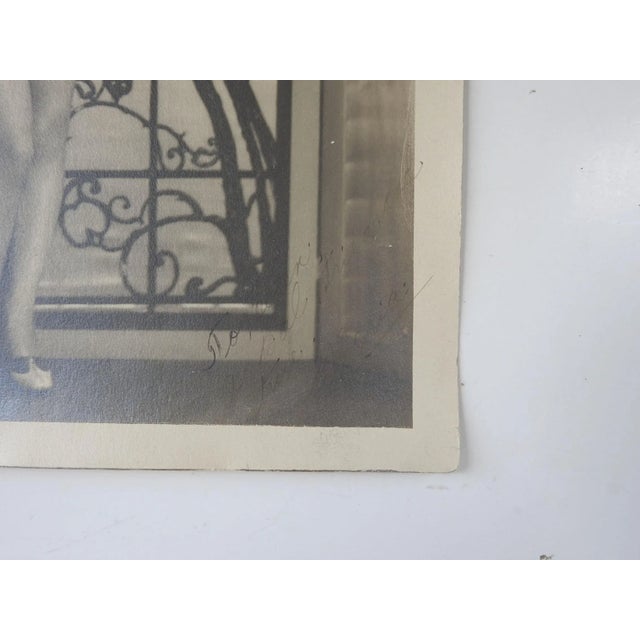 Vintage circa early 1920's oversize silver gelatin photograph of young woman in scanty feather costume. Looks like a young...