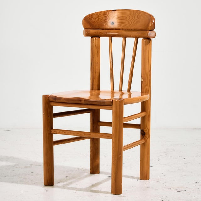 Solid pine dining chair from the 1970s designed by Rainer Daumiller. The surface of the chairs has scratches, stains and...