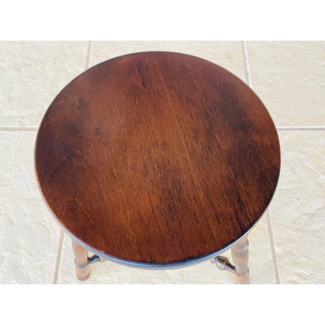 Vintage turned wood stool on tripod legs. Piece is made of walnut. Wonderful crafted, turned wood décor and pattern . It...