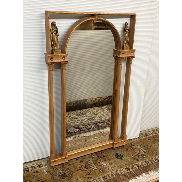 Design Plus Gallery presents a Gilt Wood Wall Mirror with Neoclassical Columns and Style. The mirror has a rectantufular...