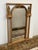 Design Plus Gallery presents a Gilt Wood Wall Mirror with Neoclassical Columns and Style. The mirror has a rectantufular...