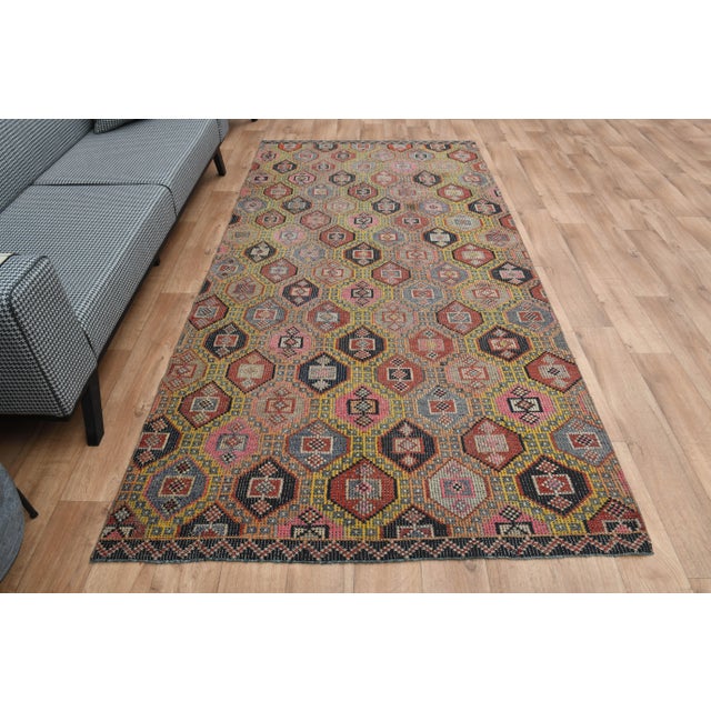 Vintage Turkish Hand-Knotted vintage rug is a semi-antique vintage area rug. The '70s Eastern region of Turkey's unique...