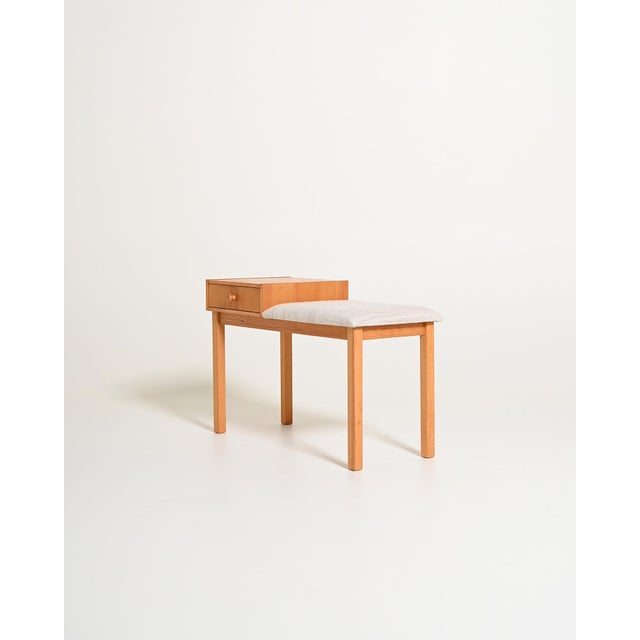 Hallway bench, known as the gossip chair, with a single drawer and padded cushion. Swedish production, 1980s. Made in...