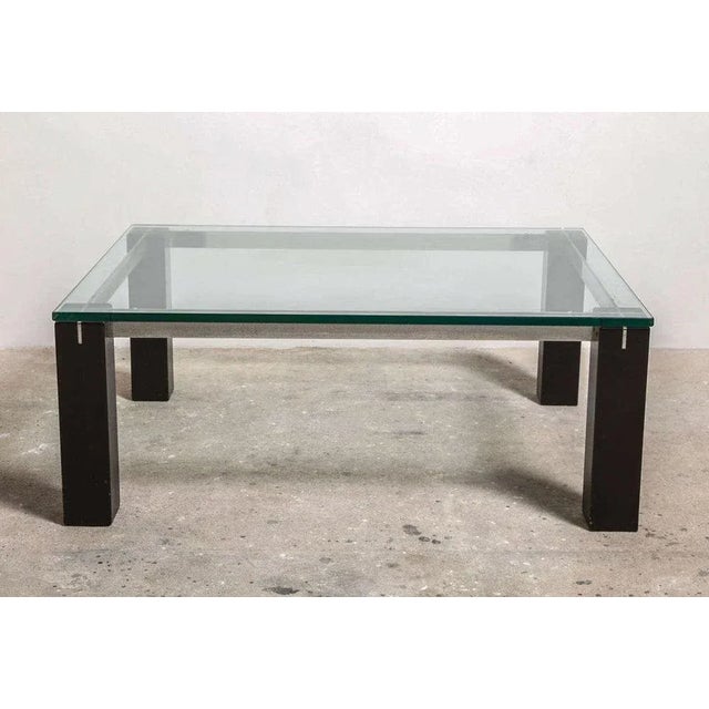 A rectangular coffee table with chromed steel and clear glass top coffee table.This midcentury modern coffee table will...