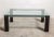 A rectangular coffee table with chromed steel and clear glass top coffee table.This midcentury modern coffee table will...