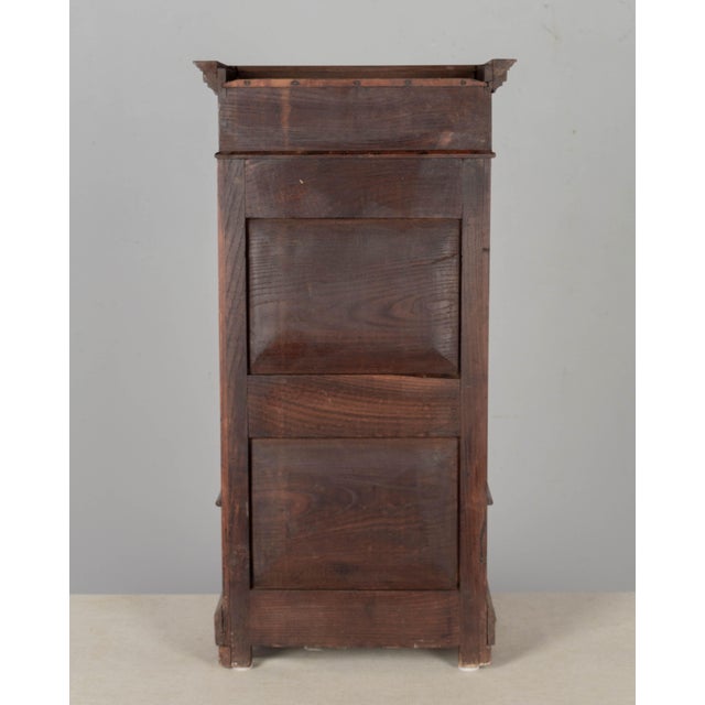 A 19th century Century French Louis Philippe style miniature armoire or sample cabinet, hand-crafted of solid walnut with...