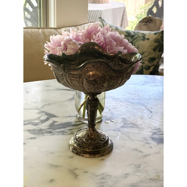 An ornate silver-plated pedestal compote attributed to Barbour International. CIRCA: 1900 MAKER'S MARK: Bottom CONDITION:...