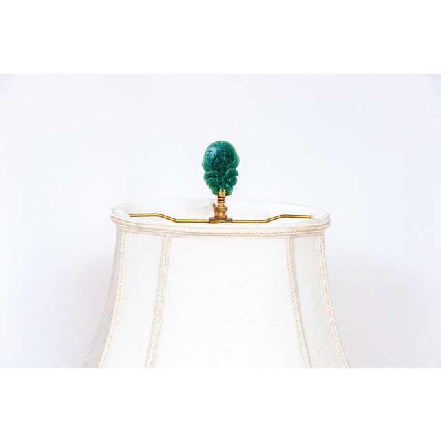 A refined and decorative Chinese export porcelain table lamp, mounted from an ovoid vase hand-painted in the famille rose...