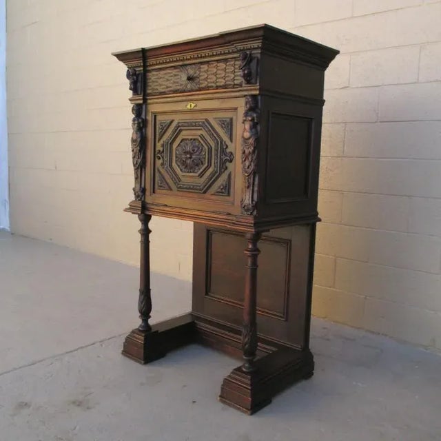 Italian carved figural drop cabinet c. 1880 This is a stunning hand carved italian cabinet, that is all original, and in...