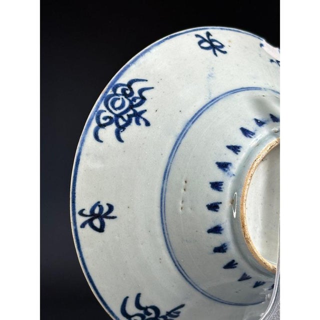Antique Chinese porcelain bowl is a rare find from the Qing Dynasty, featuring delicate blue and white patterns. Made in...