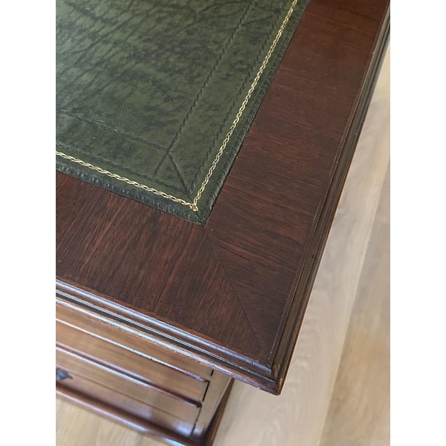 Impressively large antique mahogany desk in the partners version. Both sides of the desk feature 5 drawers and a small...
