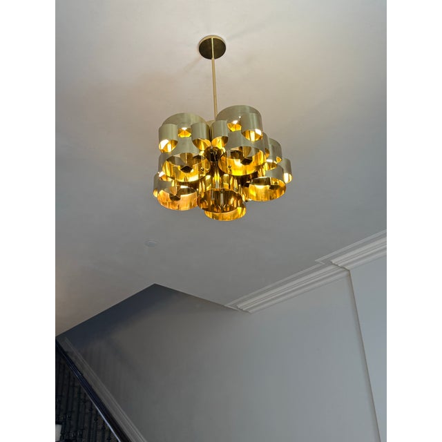This striking pair of vintage Curtis Jere pendants is composed of interlocking polished brass bands, forming a rhythmic,...