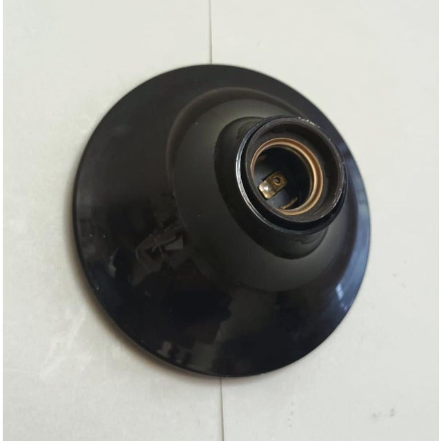 Vintage midcentury Italian "teti" wall light with black thermoplastic body, designed by Vico Magistretti for Artemide /...