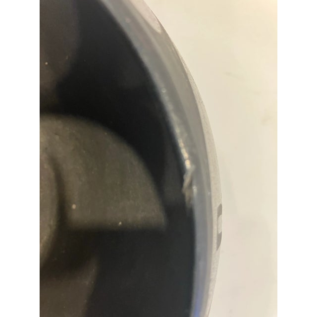 This hand crafted pottery bowl is signed Domicia, Tafoya( 1912-1979) Created in a long tradition of black pottery on the...