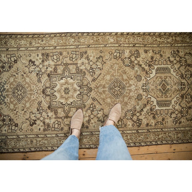 Repeating single column center medallion in alternating design relief atop a covered field of Herati stylized serrated...