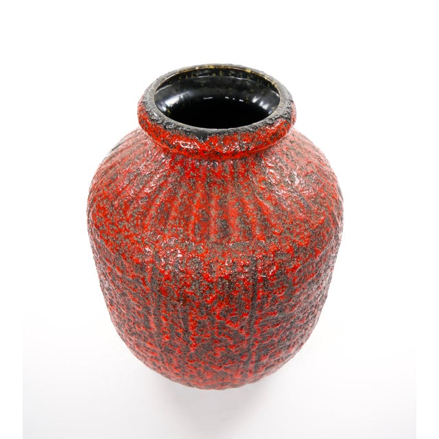 This large mid-20th century 1960s West German Fat Lava vase is a striking example of the bold and expressive pottery...