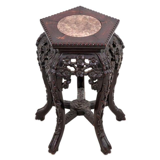 Chinese Carved Hardwood and Marble Pedestal Table, late 19th century, the pentagonal shaped inset top above a prunus...