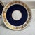 Features a distinctive gold grape vine pattern against a cobalt blue band. Below the main stamp on the middle piece, you...
