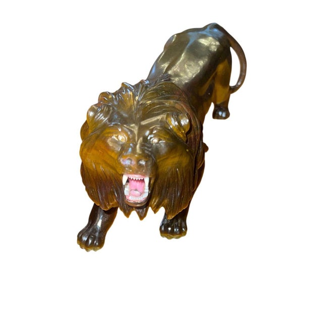An exceptional carved tiger’s eye quartz figure of a roaring lion, attributed to renowned Idar-Oberstein gem sculptor...