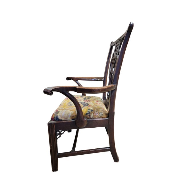 A Late 18th Century Mahogany Chippendale Armchair with a carved and pieced back splat with serpentine arms on Marlborough...