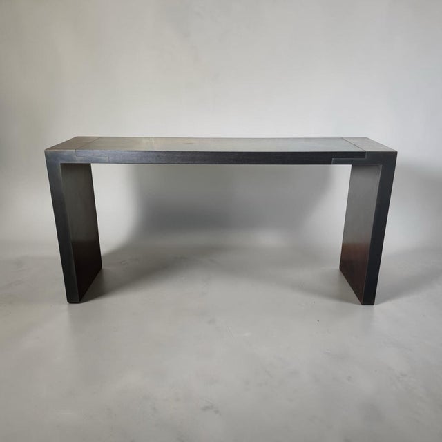 A custom console table from legendary designer Christian Liaigre (French, 1943-2020). Bespoke piece handmade from ebonized...