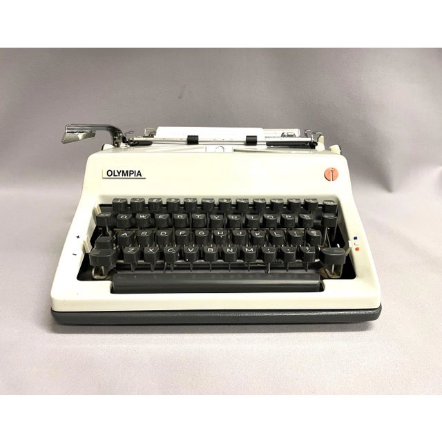A 1970 Olympia portable typewriter, model SM8. The vintage typewriter is from the popular and sturdy Olympia SM series...