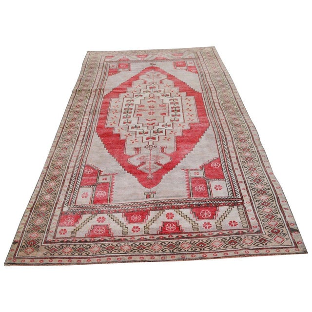 Hand-knotted with care using traditional rug-making techniques, this wool rug blends timeless craftsmanship with a modern...