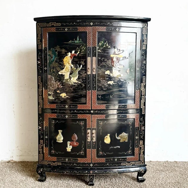 ional Chinese artistry. The cabinet's elegant demi lune shape is complemented by a rich black lacquered finish, providing...