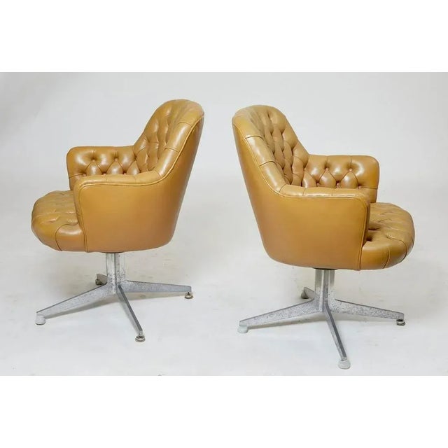 1950s Midcentury modern Tufted Beige Leather Swivel Armchairs-a Pair Dimensions: height 33in (84cm); width 25 1/2in...