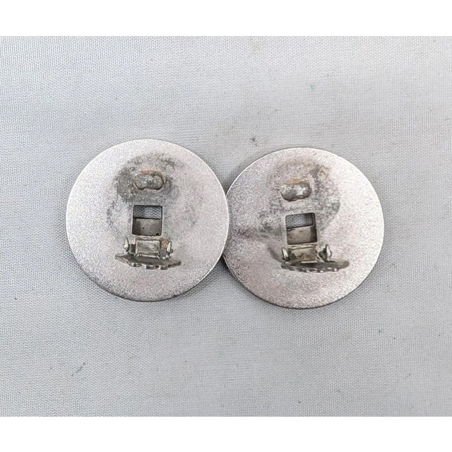 Silver Vintage Signed Napier Doris Day Rhodium Plated Two Stacked Asian Coins Clip Earrings-2 Pieces For Sale - Image 8 of 9