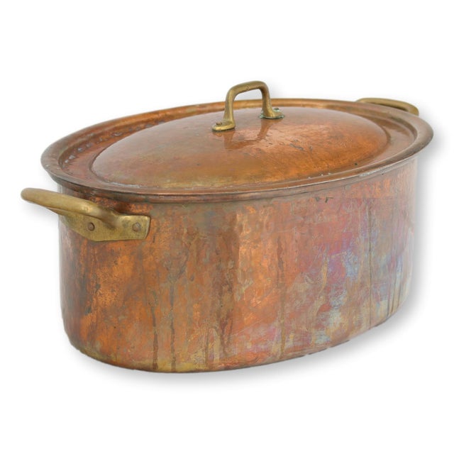 Large antique French hammered copper pot dating to the 19th century, crafted from heavy-gauge copper with traditional...