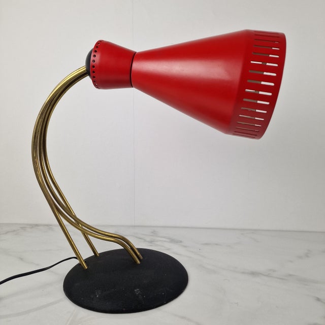 This exceptionally rare and adjustable desk lamp by bag turgi exemplifies the highest standards of swiss mid-century...