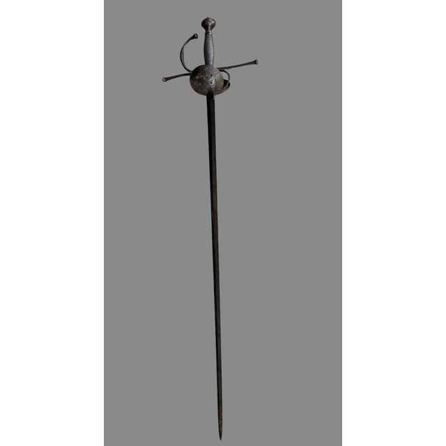 17th century shell-shaped rapier with a tazaIron hilt, pierced shell guard, filigreed iron gripStraight blade with two...
