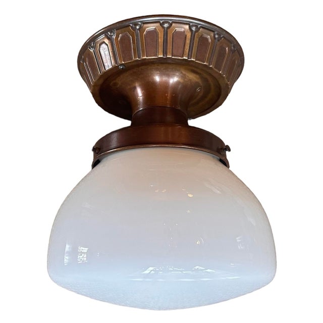 This is a great original deco fixture in its original patina of aging brass and original white cased glass shade…...