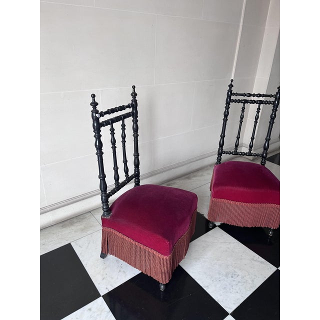2 Parisian armchairs from the Napoleon 3 period, in blackened wood, seat in red velvet, good original condition.