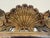A striking and highly sculptural 20th century Italian carved wood mirror, richly ornamented with scrolling acanthus...
