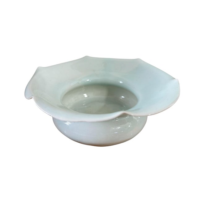 Vintage Song Dynasty style celadon bowl with a distinctive flower-shaped rim. This elegant 5.5" diameter piece showcases...