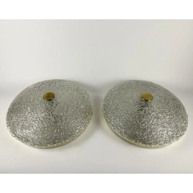 Beautiful vintage set of 2 ceiling lamps. brass and glass large flush mount fixtures. a lamp is a light source that should...
