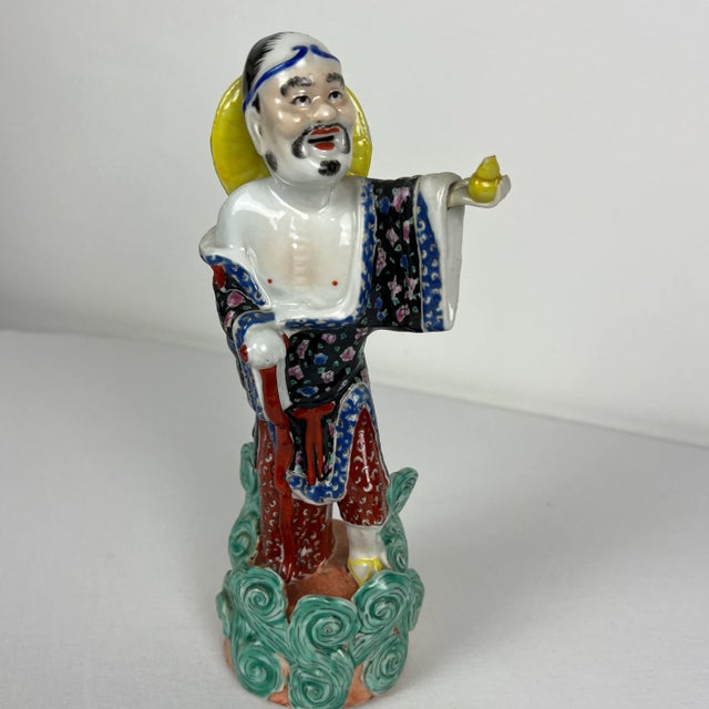 Beautiful Famille Rose immortal figurine. Made in the 1920s-1930s in China. Beautiful colors! The hand is removable but...