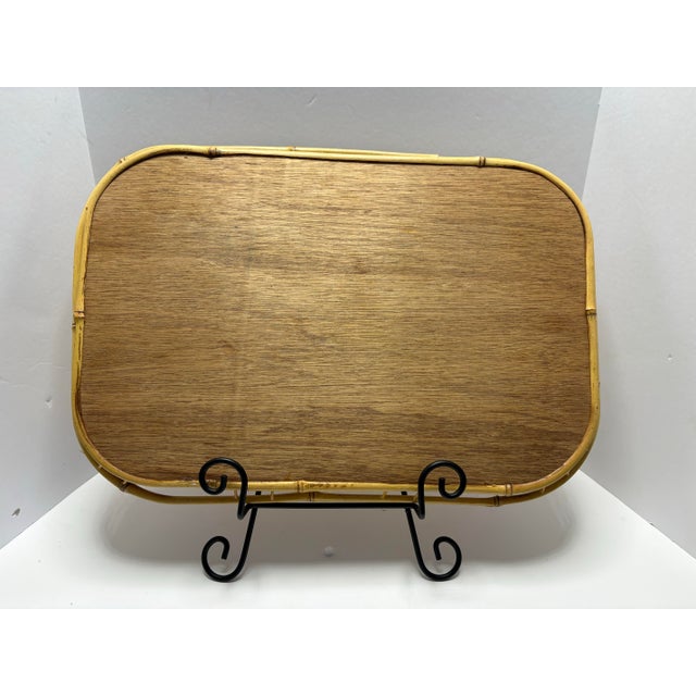 A substantial and visually cohesive set of ten vintage bamboo serving trays featuring woven rattan-style inset panels and...